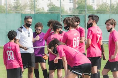 Youth sports team celebrating together - representing clubs creating successful profiles